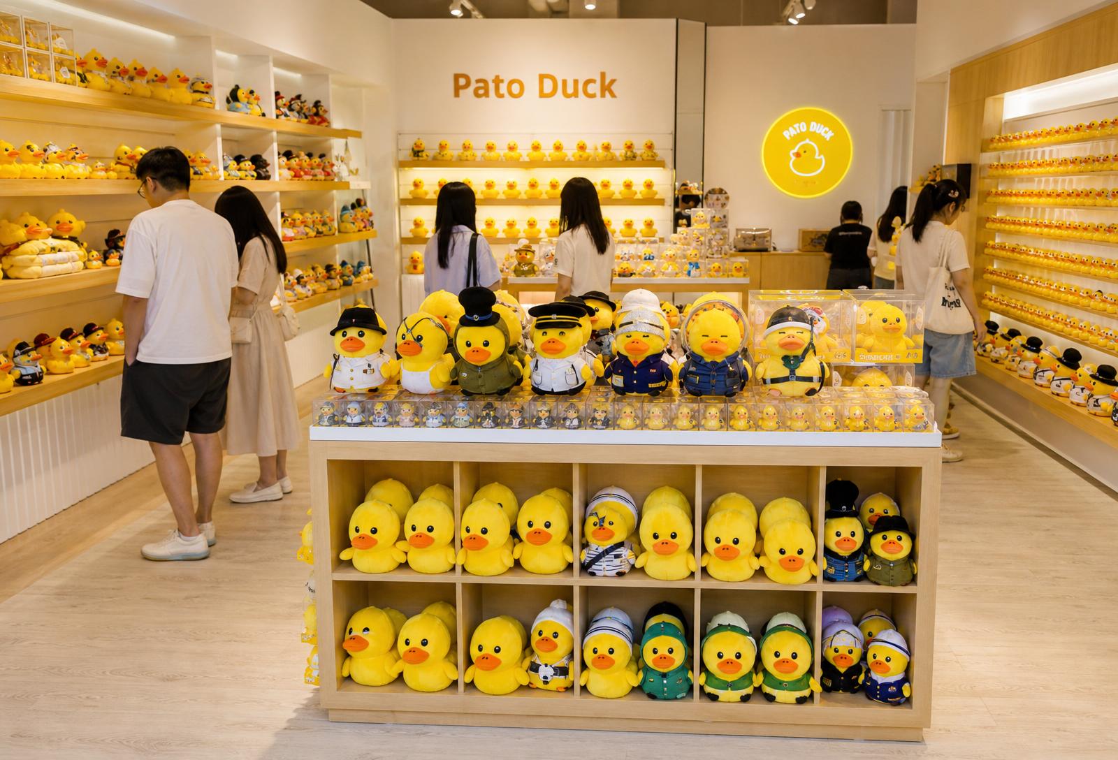 Main floor with themed duck shelves and families browsing